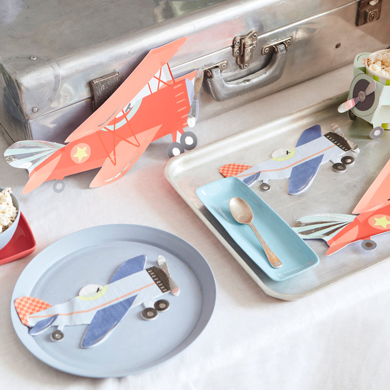 Blue and orange airplane shaped plates and napkins for kids birthday from Parte Haus party supply store in Bethesda MD
