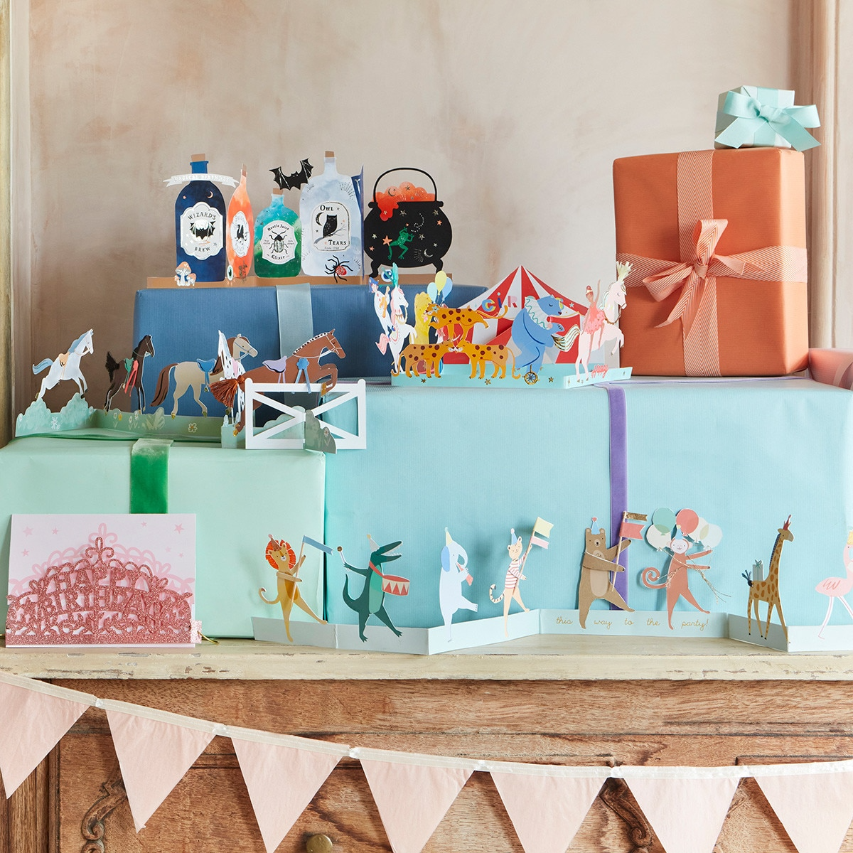 Colorful gift boxes with whimsical circus and animal themed decorations for birthday from Parte Haus party supply store in Bethesda Maryland