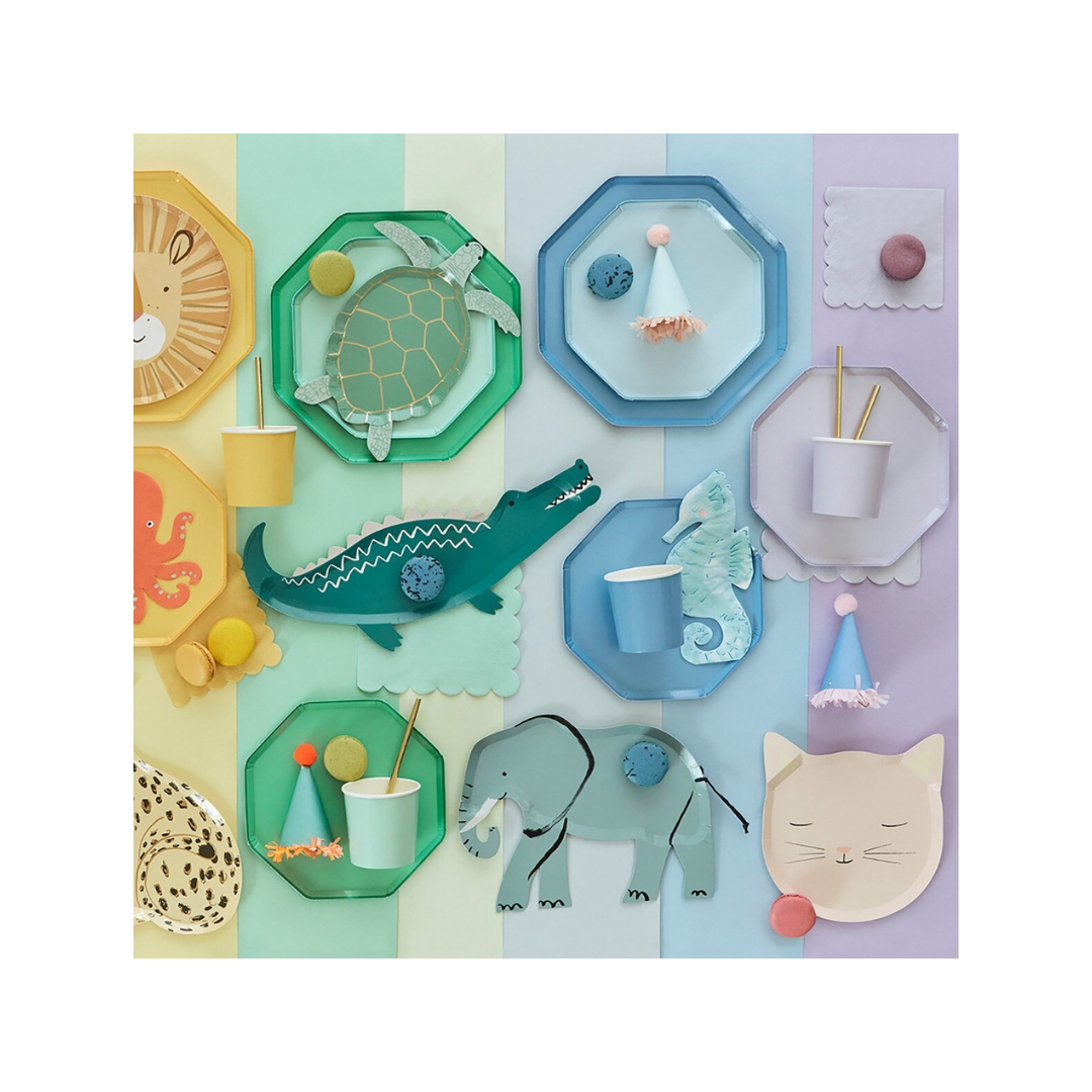 Colorful animal shaped plates cups and napkins on pastel table for kids birthday from Parte Haus party supply store in Bethesda MD