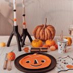 Orange pumpkin shaped plate and Halloween table decor for Halloween from Parte Haus party supply store in Bethesda Maryland