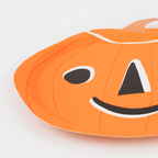 Orange pumpkin shaped plate with a smiling face for Halloween from Parte Haus party supply store in Bethesda MD.