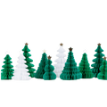 Green and white honeycomb paper Christmas trees with gold and white stars holiday decor from Parte Haus party supply store in Bethesda Maryland