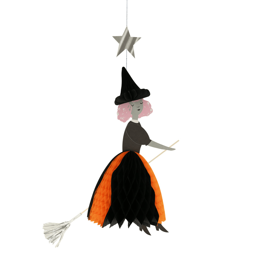 Black and orange witch hanging Halloween decoration with broom from Parte Haus party supply store in Bethesda Maryland