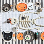 Black orange and white Halloween tableware with pumpkin skull and cat plates for Halloween from Parte Haus party supply store in Bethesda MD