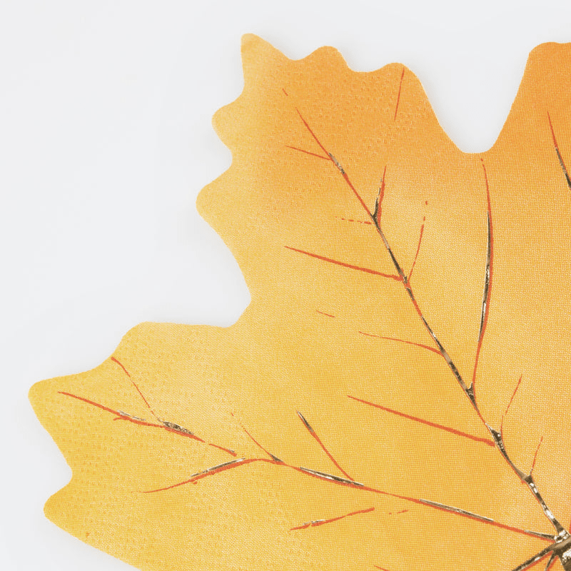 Yellow leaf napkin with gold and orange veins for fall gatherings from Parte Haus party supply store in Bethesda Maryland