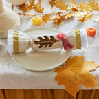 Gold and white autumn table cracker with leaf accent for Thanksgiving from Parte Haus party supply store in Bethesda MD