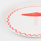 Red mushroom paper plate with wavy border whimsical forest birthday from Parte Haus party supply store in Bethesda MD