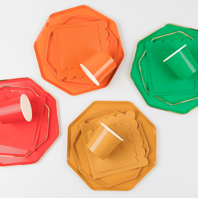 Red orange green and gold paper plates cups and napkins festive tableware from Parte Haus party supply store in Bethesda MD