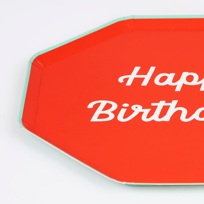 Red octagon paper plate with Happy Birthday text for birthday from Parte Haus party supply store in Bethesda MD