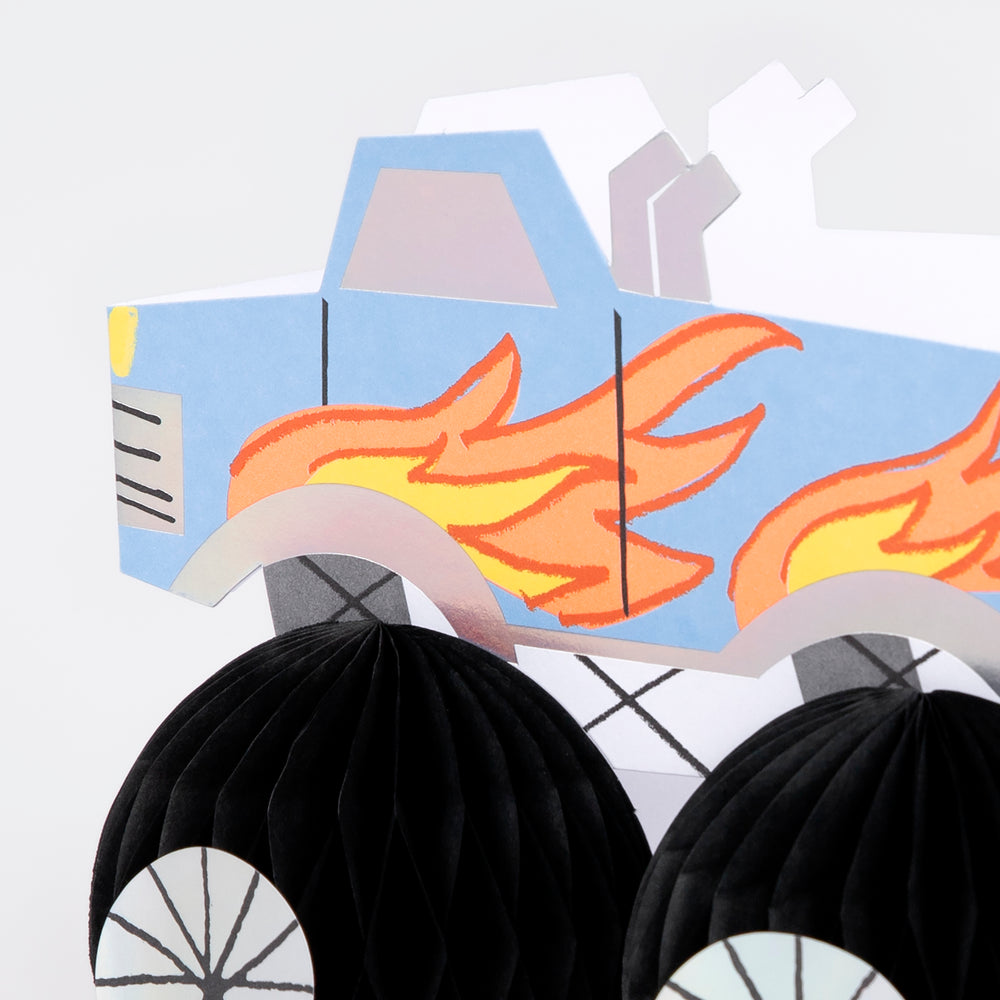 Blue monster truck decoration with flame design birthday theme from Parte Haus party supply store in Bethesda MD