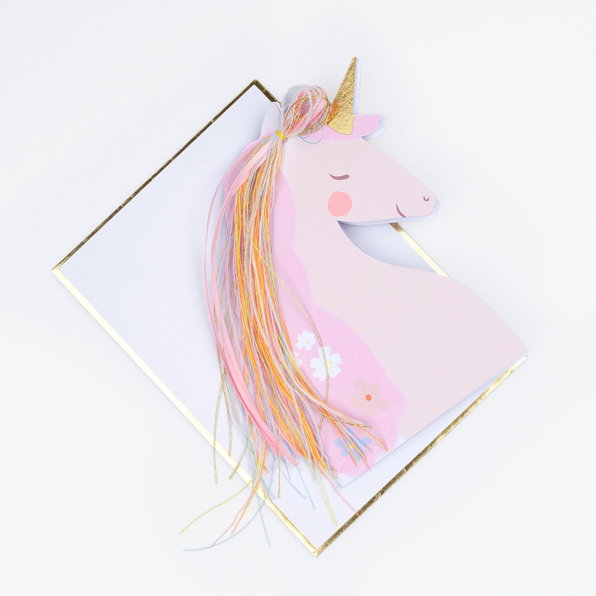 Pink unicorn shaped card with gold horn and rainbow mane for birthday from Parte Haus party supply store in Bethesda MD