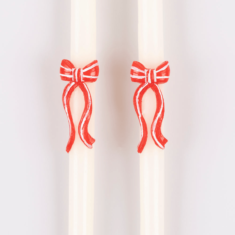 Red and white bow taper candles holiday decor from Parte Haus party supply store in Bethesda Maryland