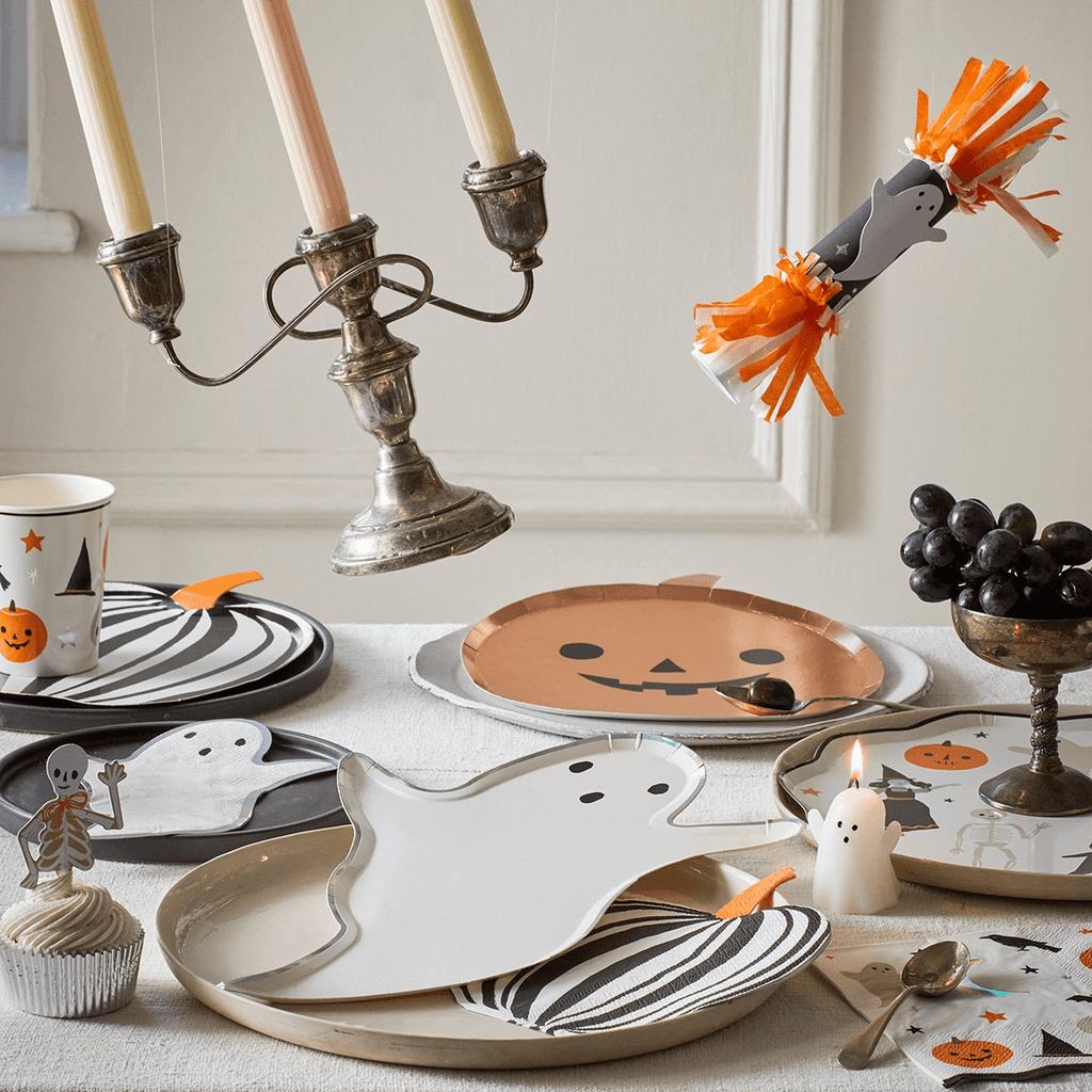 White and orange ghost and pumpkin Halloween plates and cups for Halloween from Parte Haus party supply store in Bethesda MD