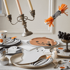 White and orange ghost and pumpkin Halloween plates and cups for Halloween from Parte Haus party supply store in Bethesda MD