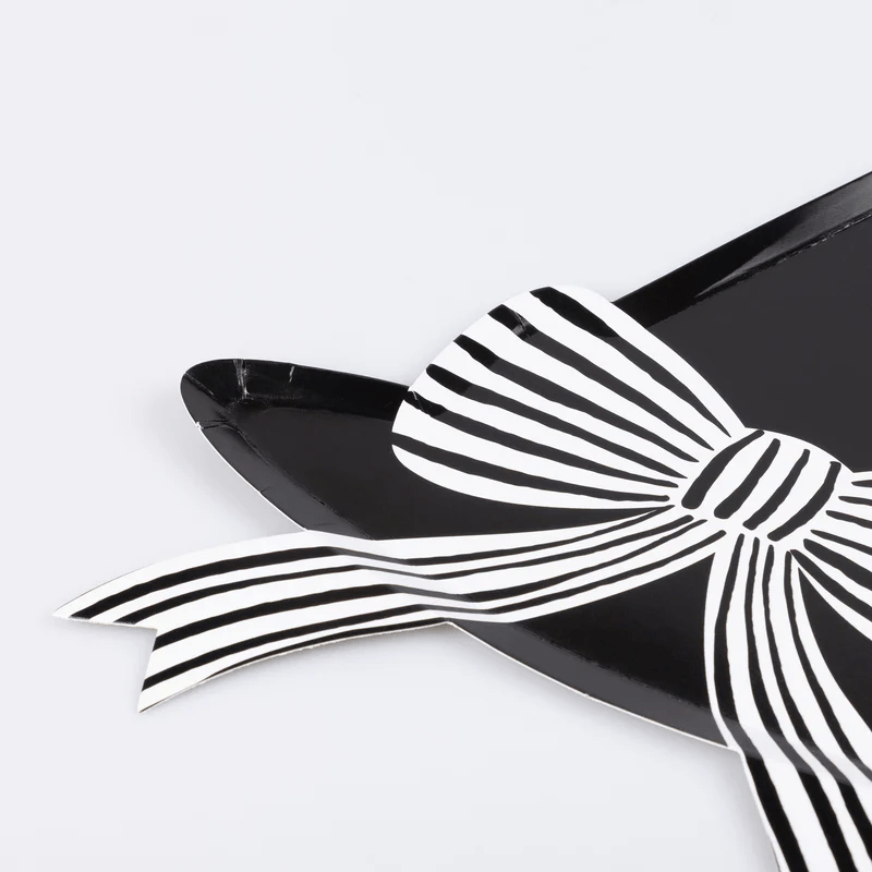 Black and white bow shaped plate with stripes modern celebration from Parte Haus party supply store in Bethesda Maryland