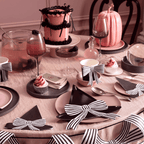 Pink and black witch hat table decor with striped bows Halloween from Parte Haus party supply store in Bethesda Maryland