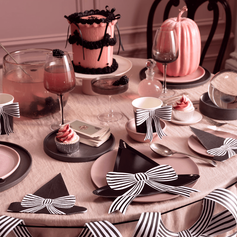 Pink and black witch hat table decor with striped bows Halloween from Parte Haus party supply store in Bethesda Maryland