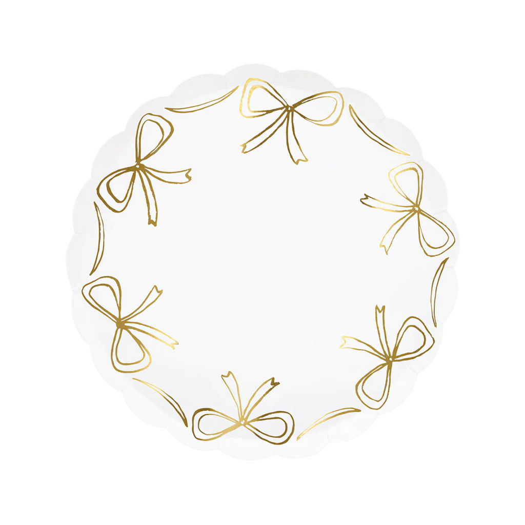 White scalloped plate with gold bows elegant tableware for birthday from Parte Haus party supply store in Bethesda MD.