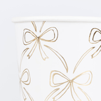 White and gold paper cup with bow design for elegant celebrations from Parte Haus party supply store in Bethesda MD