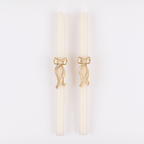 Ivory taper candles with gold bow accent for elegant dinner celebrations from Parte Haus party supply store in Bethesda MD