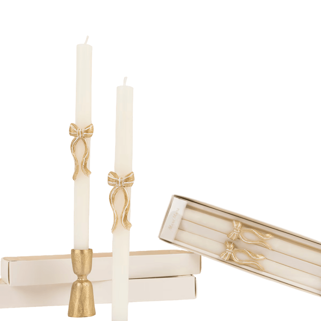 Ivory gold bow taper candles elegant decor for celebration from Parte Haus party supply store in Bethesda MD