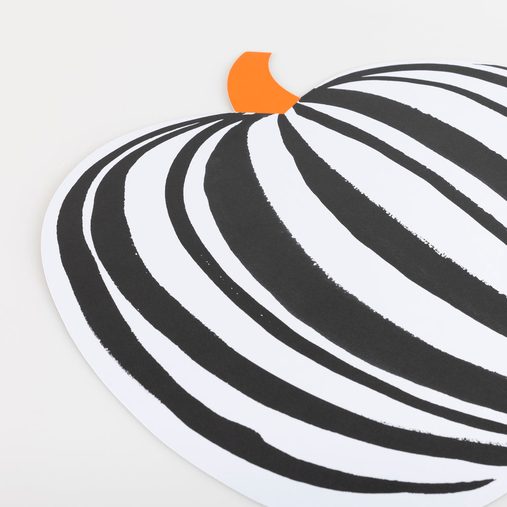 Black and white pumpkin paper placemat with orange stem Halloween theme from Parte Haus party supply store in Bethesda MD