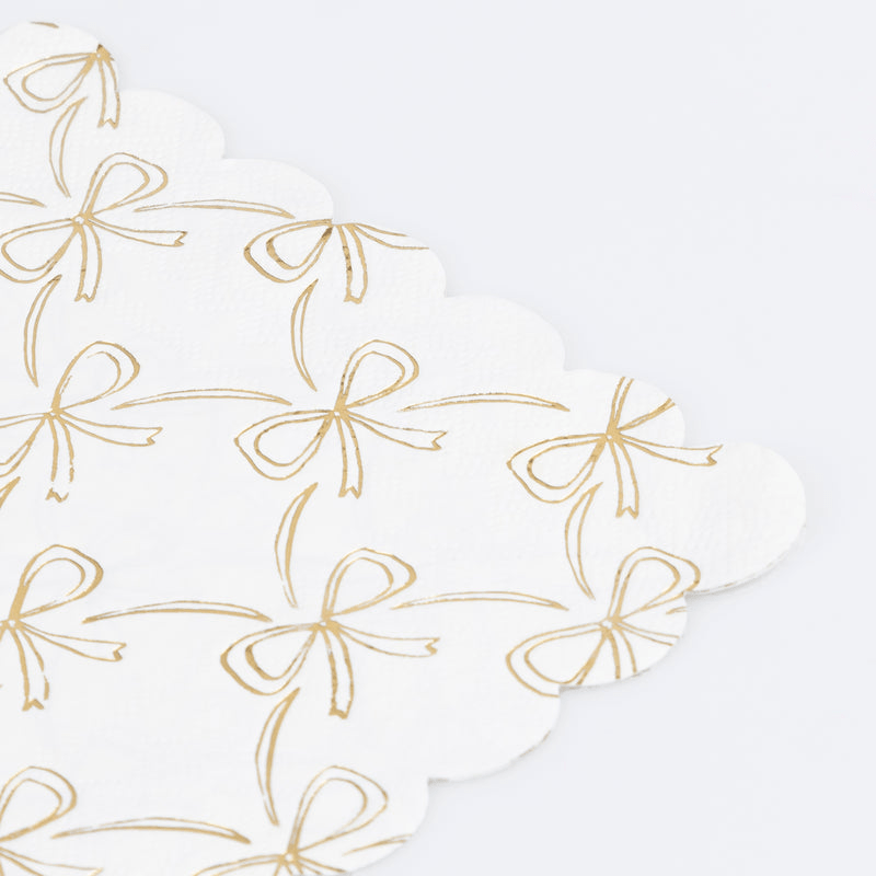 White and gold napkin with bow pattern for celebration from Parte Haus party supply store in Bethesda MD