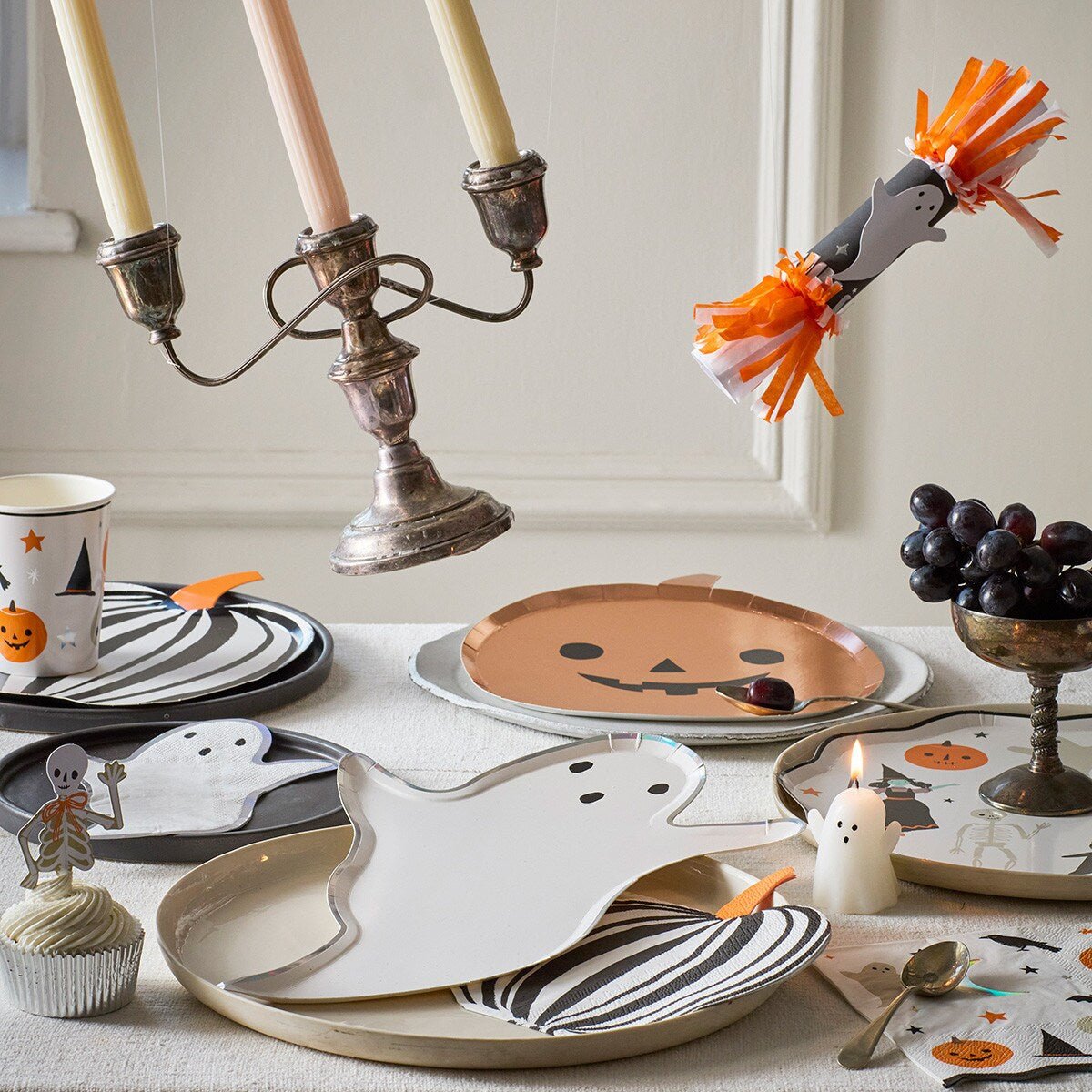 White ghost and orange pumpkin Halloween plates festive table decor from Parte Haus party supply store in Bethesda MD