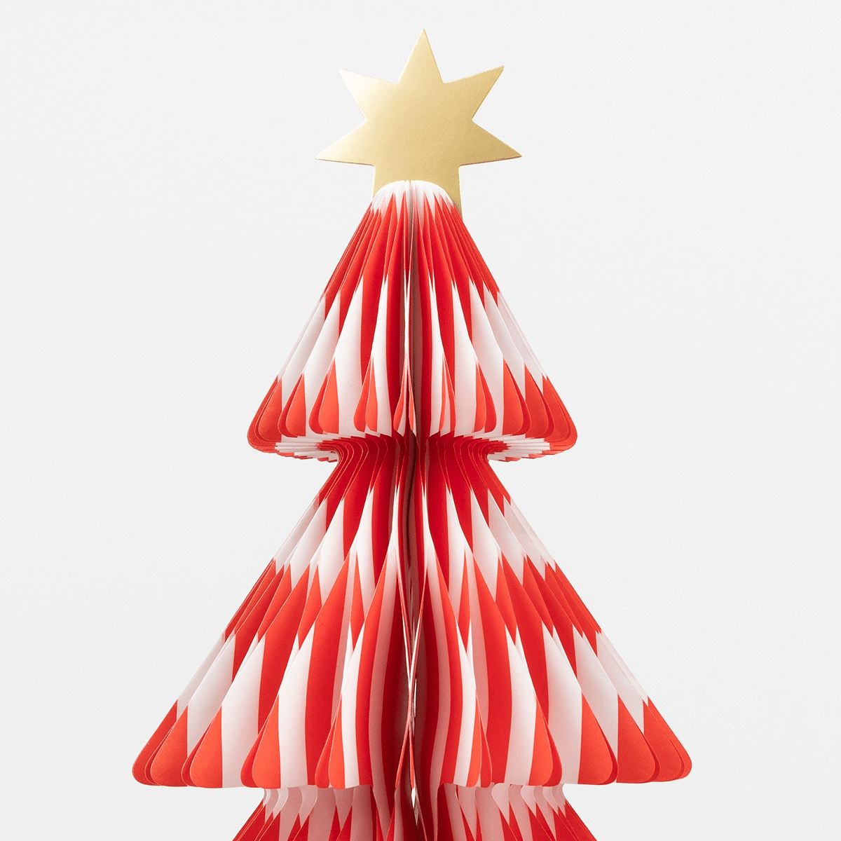 Red and white Christmas tree paper centerpiece with gold star for holiday party from Parte Haus party supply store in Bethesda MD