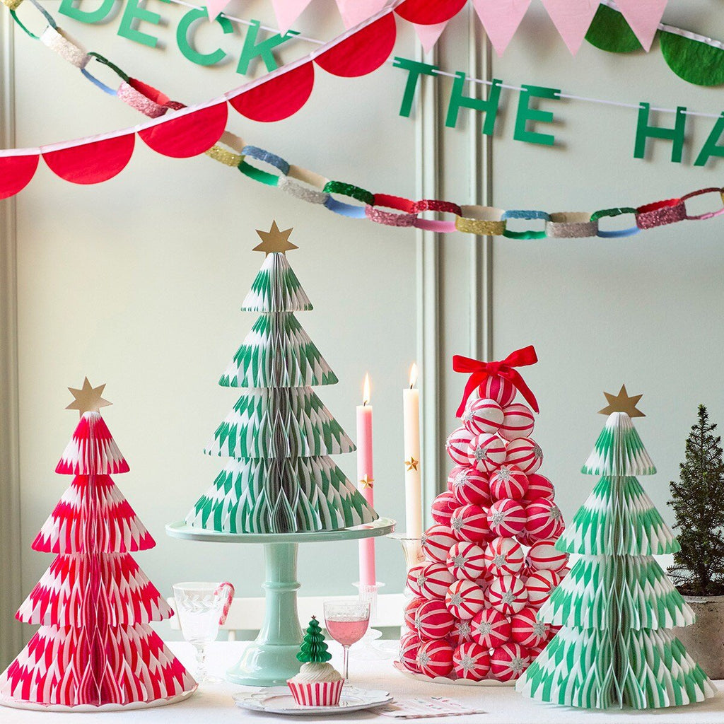 Red green and white paper Christmas tree decorations with gold stars for holiday from Parte Haus party supply store in Bethesda Maryland