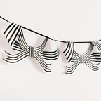 Black and white striped bow garland decoration for birthday from Parte Haus party supply store in Bethesda MD