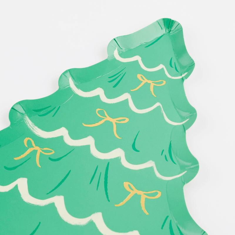 Green Christmas tree paper plate with gold bows for holiday celebration from Parte Haus party supply store in Bethesda Maryland