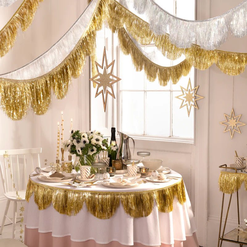Gold and silver fringe garland elegant table decorations for celebration from Parte Haus party supply store in Bethesda Maryland