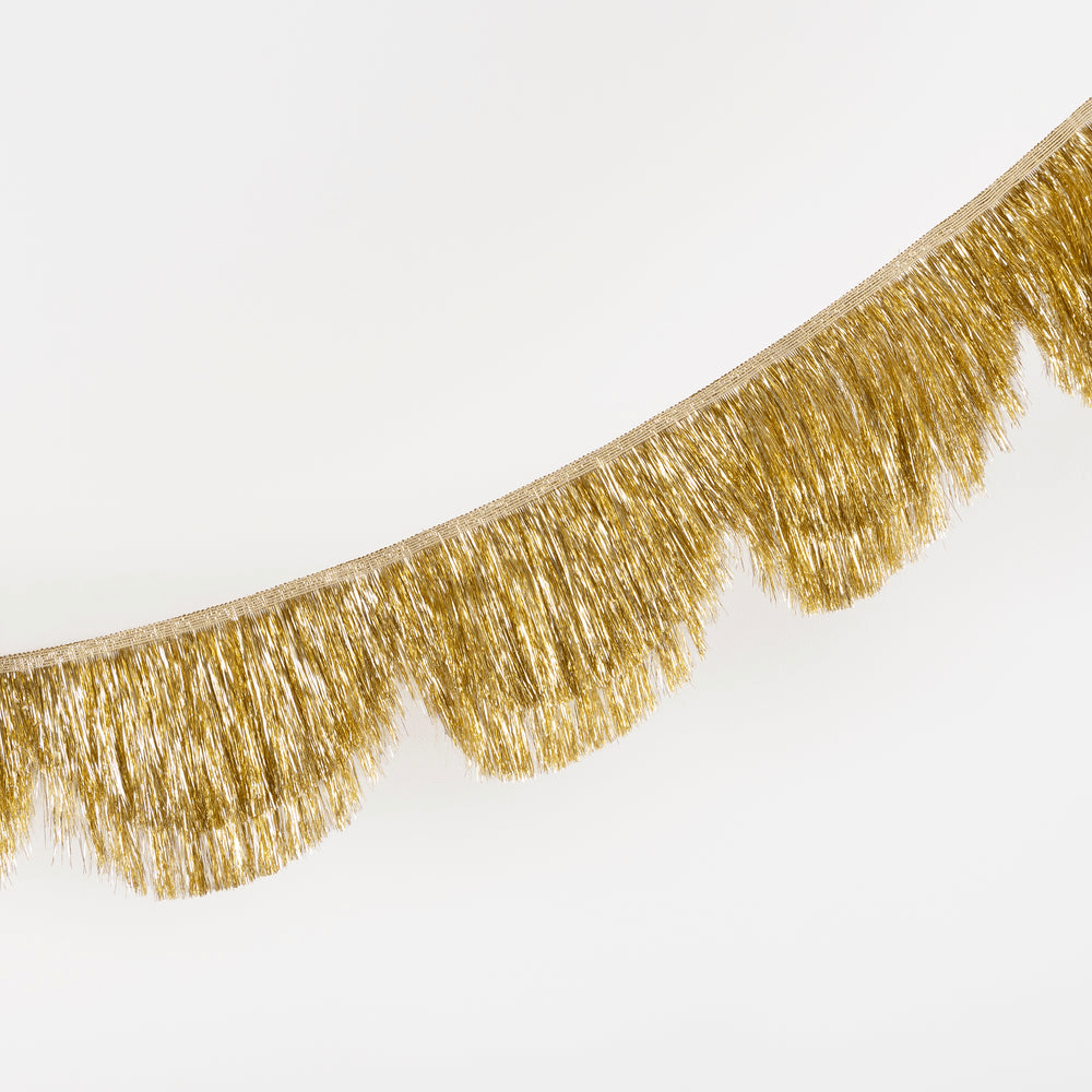 Gold fringe garland with shiny tinsel perfect for celebrations from Parte Haus party supply store in Bethesda MD