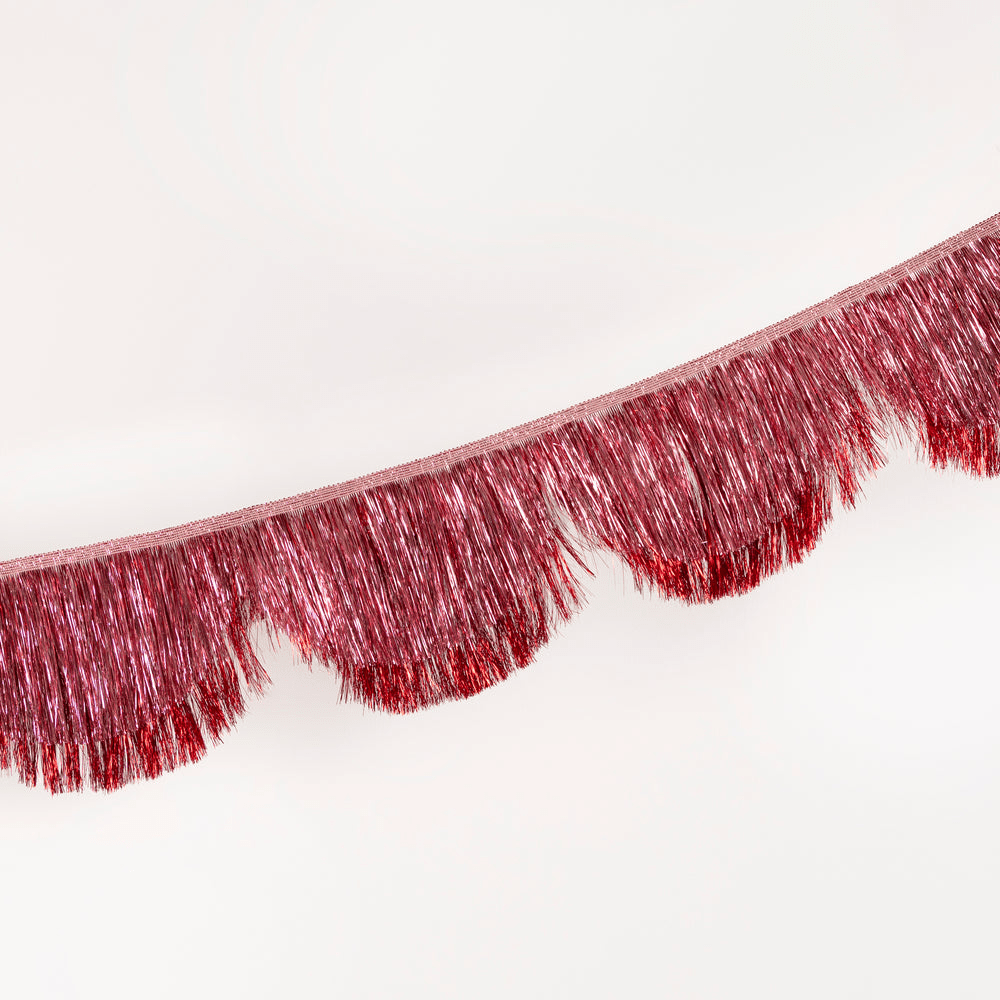 Red tinsel fringe garland with metallic shine decoration from Parte Haus party supply store in Bethesda MD