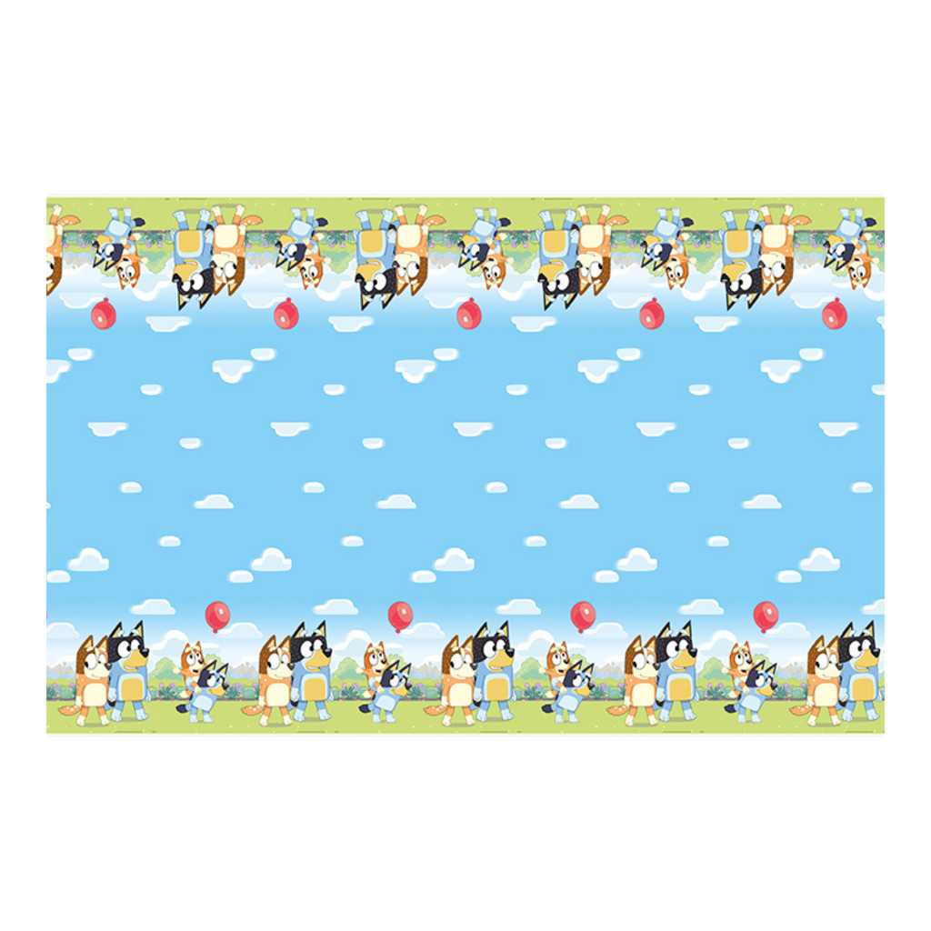 Bluey table cover with blue sky clouds cartoon dogs and red balloons birthday design from Parte Haus party supply store in Bethesda Maryland
