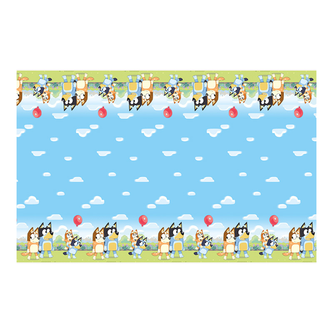 Bluey table cover with blue sky clouds cartoon dogs and red balloons birthday design from Parte Haus party supply store in Bethesda Maryland