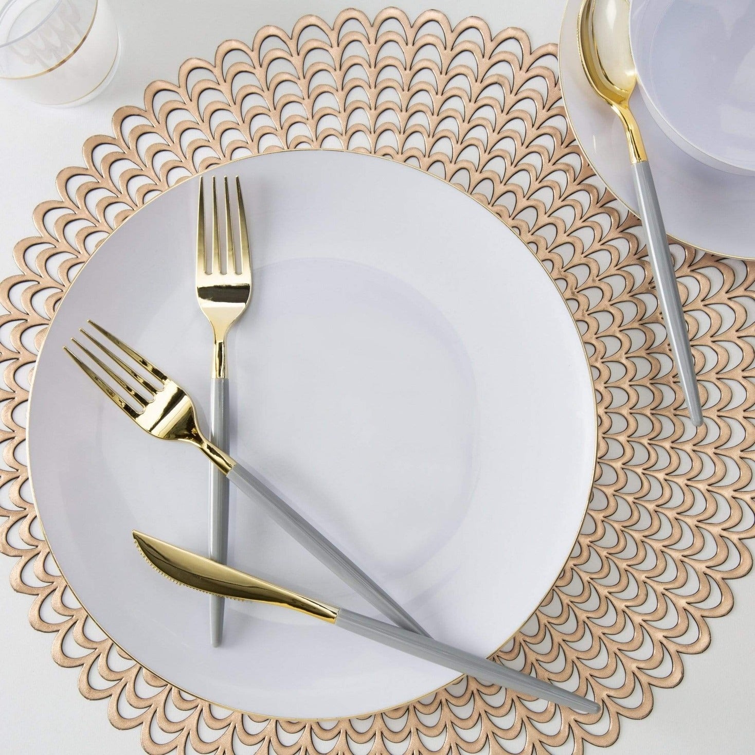 Gold and white plate set with gold flatware elegant dinner setting from Parte Haus party supply store in Bethesda MD