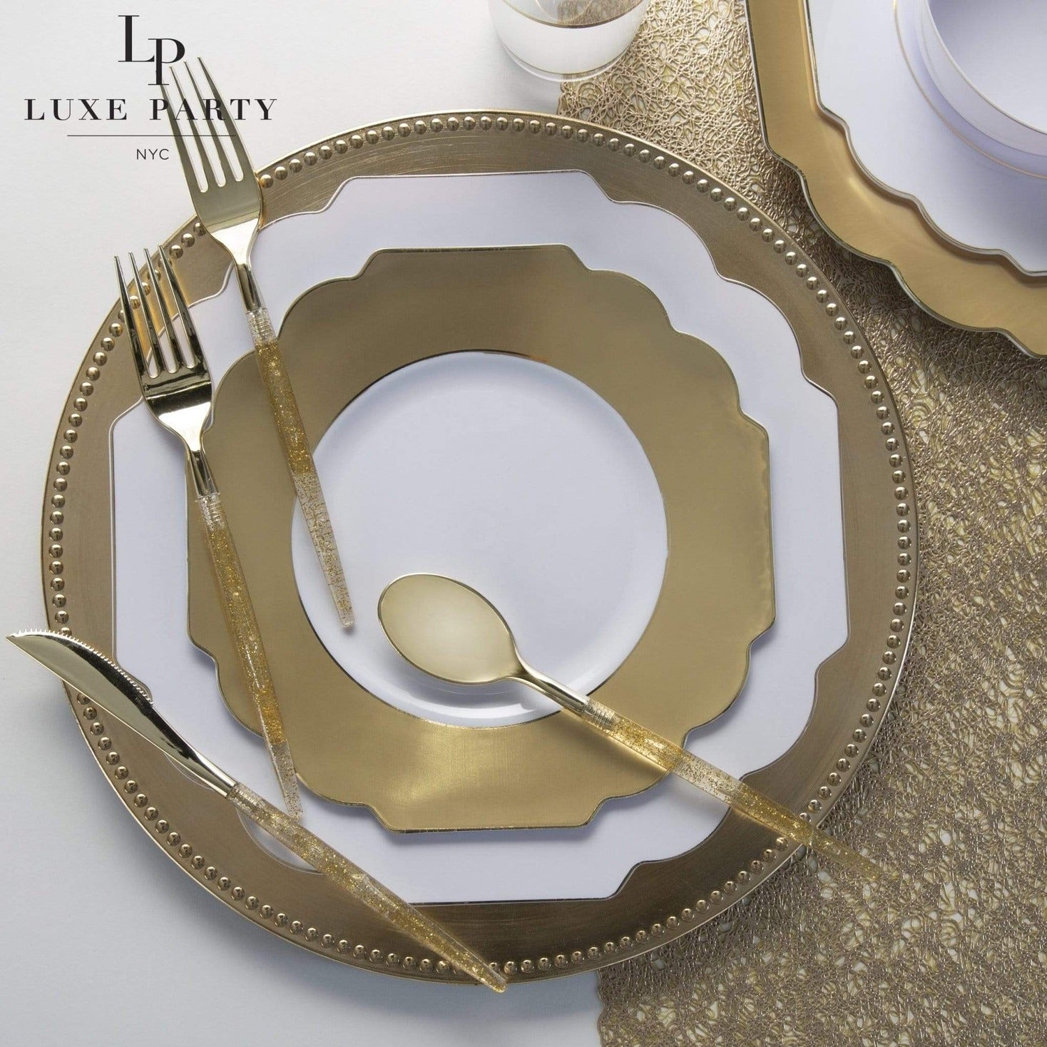 Gold and white plate set with gold cutlery for elegant celebration from Parte Haus party supply store in Bethesda Maryland