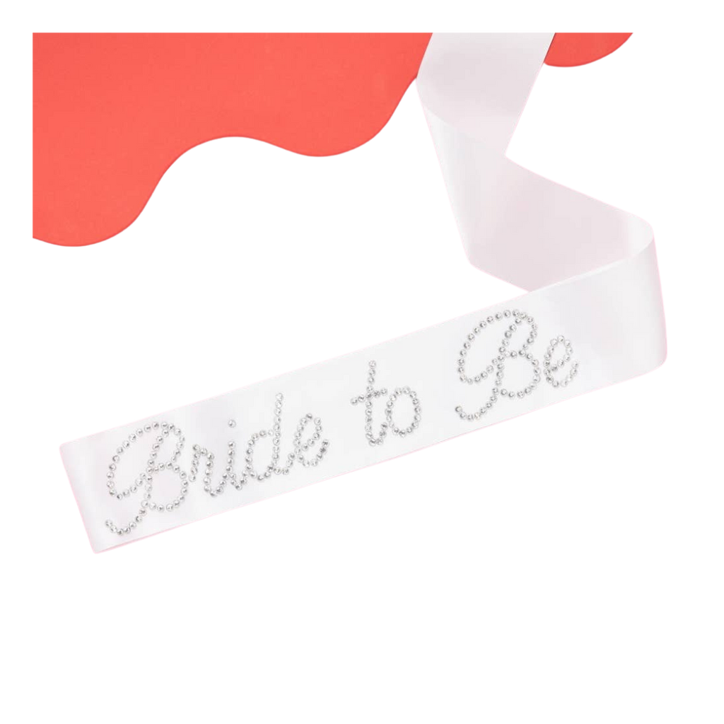 White Bride to Be sash with rhinestone lettering for bridal shower from Parte Haus party supply store in Bethesda Maryland