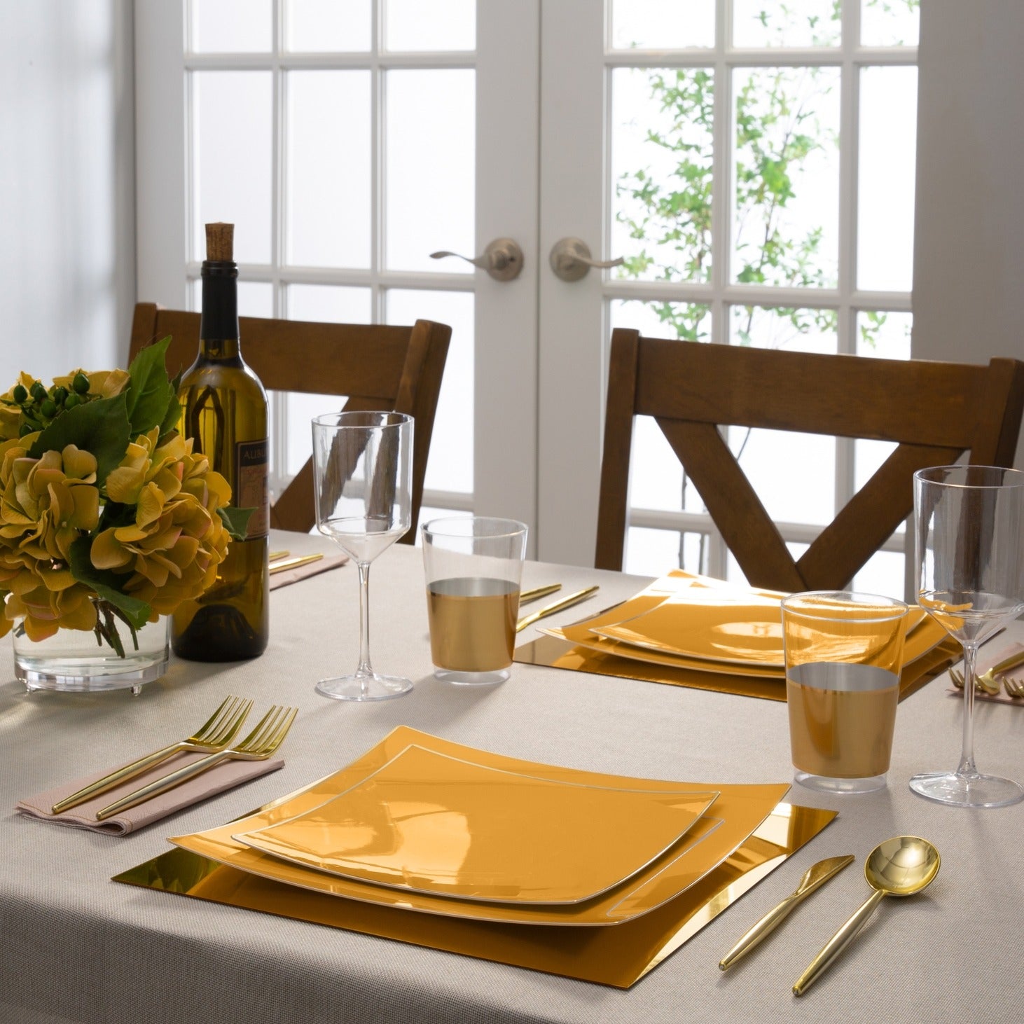 Gold square dinner plates on elegant table setting for formal dinner from Parte Haus party supply store in Bethesda MD