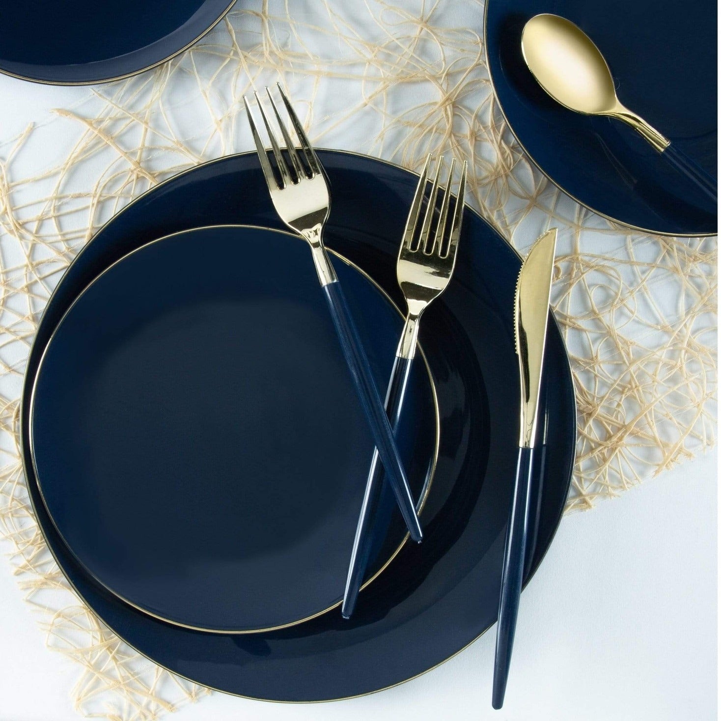 Navy blue and gold dinnerware set with matching cutlery elegant table setting from Parte Haus party supply store in Bethesda MD
