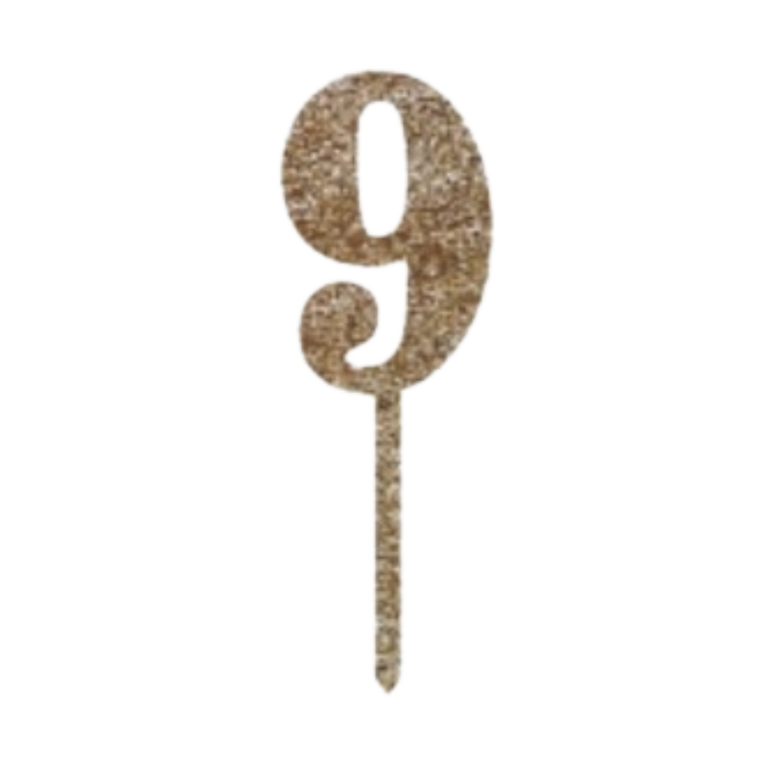 Gold glitter number 9 cake topper for birthday celebration from Parte Haus party supply store in Bethesda MD.