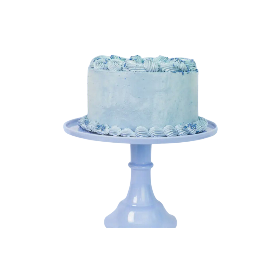 Pastel blue cake stand with round cake topped with blue icing birthday theme from Parte Haus party supply store in Bethesda MD