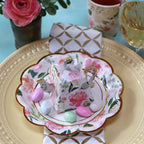 Pink floral teapot favor box with pastel candies on floral plate tea party theme from Parte Haus party supply store in Bethesda MD