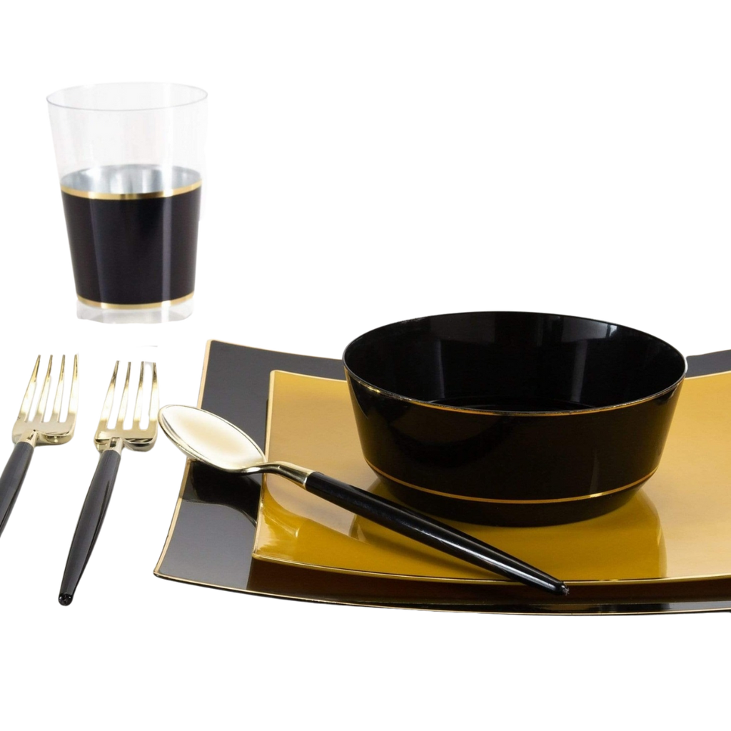 Black and gold dinnerware set with matching utensils and glass modern table setting from Parte Haus party supply store in Bethesda MD