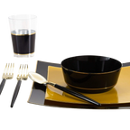 Black and gold dinnerware set with matching utensils and glass modern table setting from Parte Haus party supply store in Bethesda MD
