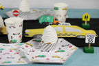 Multicolor vehicle themed plates cups and cupcake topper for kids birthday from Parte Haus party supply store in Bethesda MD.