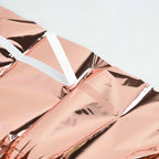 Rose gold foil curtain with white hanging strip birthday decor from Parte Haus party supply store in Bethesda MD