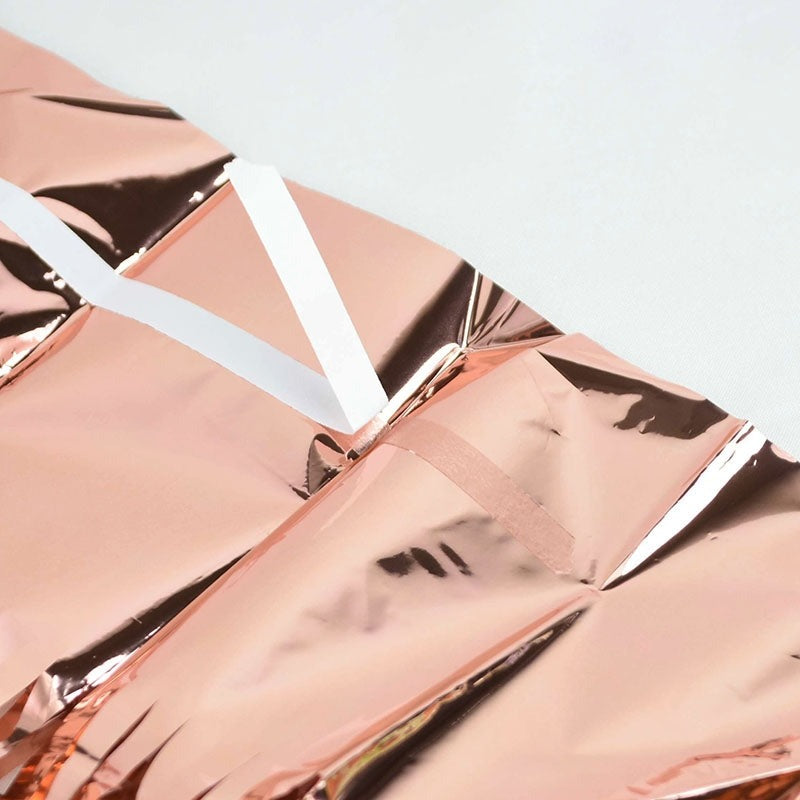 Rose gold foil curtain with white hanging strip birthday decor from Parte Haus party supply store in Bethesda MD